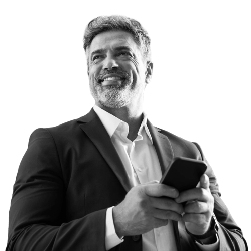 A man in a suit on his mobile device