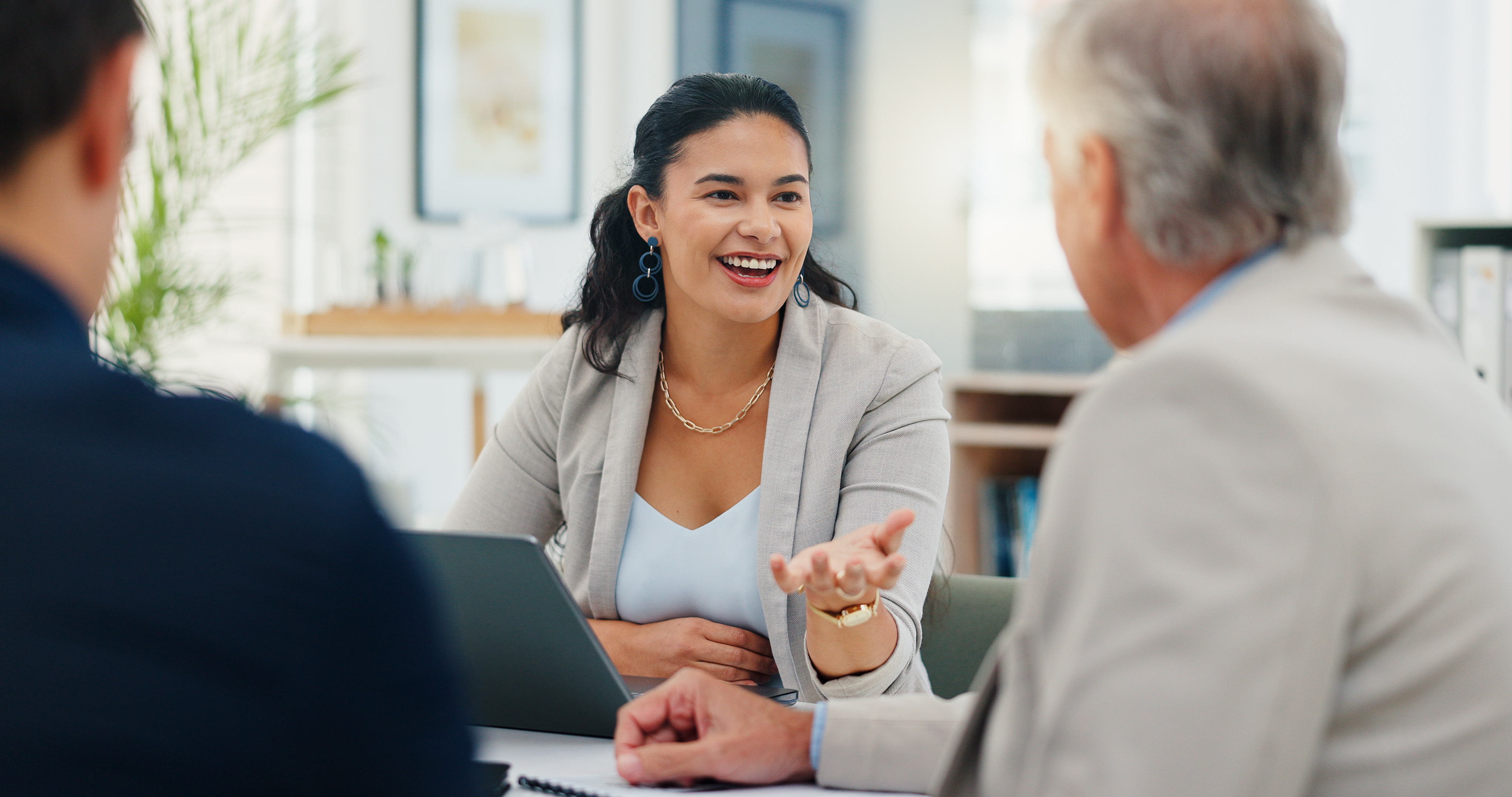 A woman talking to a person in an office setting